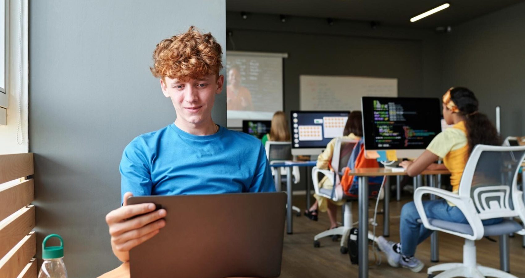 student-using-laptop-in-class-sitting-by-window-2026-01-09-00-44-32-utc (1)